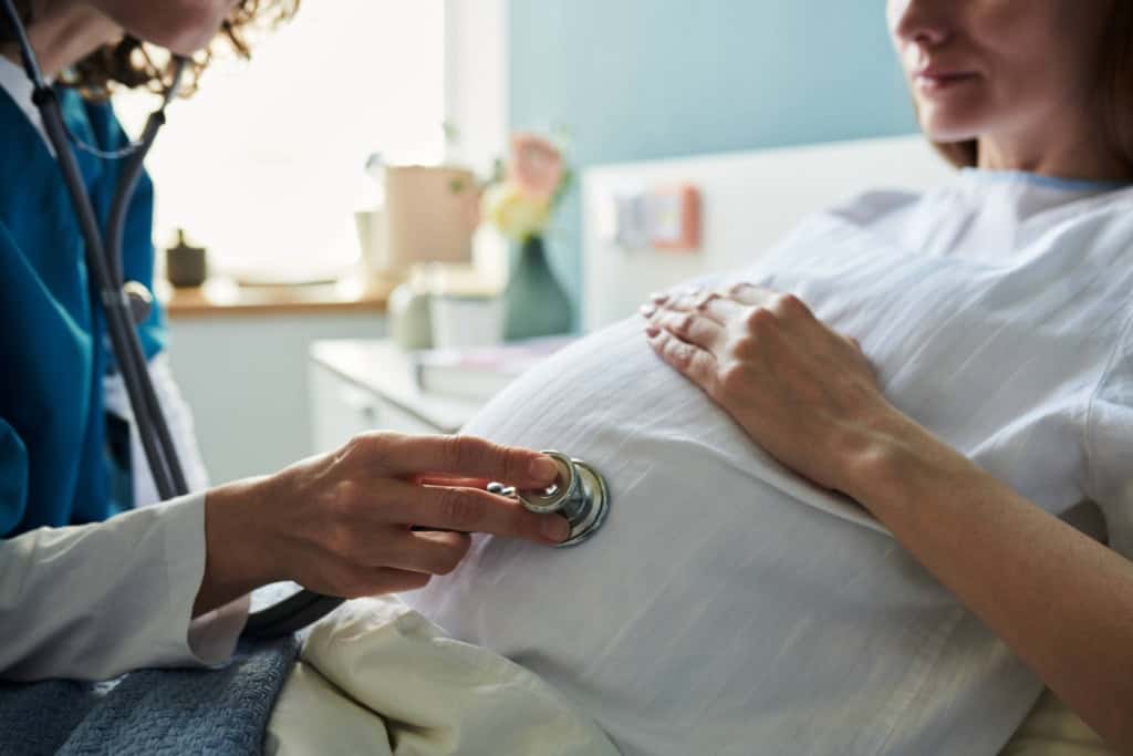a pregnant woman having a prenatal checkup which is covered by maternity insurance