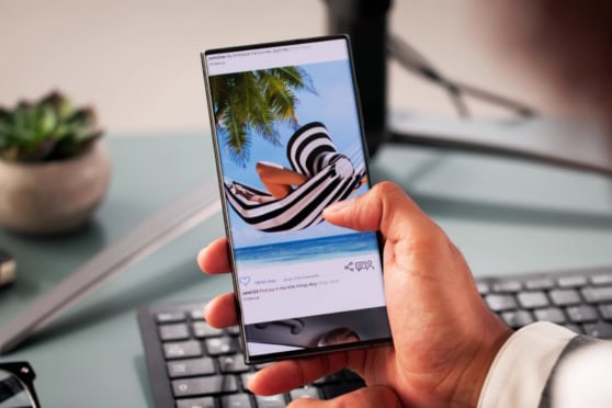 a cell phone showing an image of a woman relaxing on holiday in a hammock, showing research as being the first item on an international travel checklist