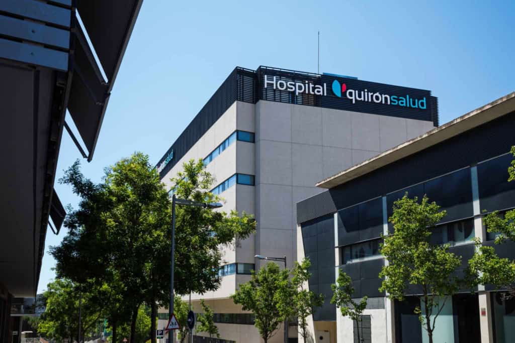 Exterior of Hospital QuirĂłnsalud, a private hospital where foreigners with health insurance in Spain can access medical care.