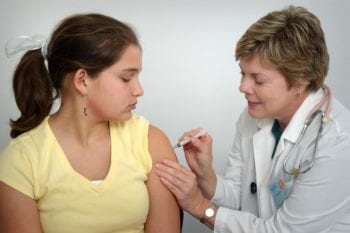 Doctor in Chile administering care at a private health facility