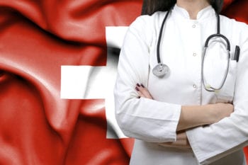 Swiss doctor with flag of Switzerland