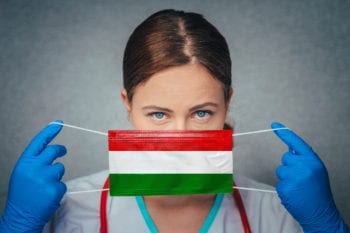 hungarian doctor holding face mask