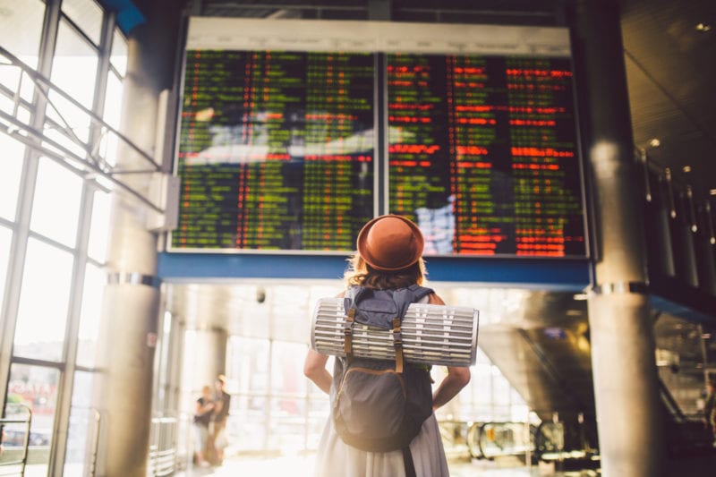 woman looking at cancelled flight
