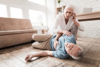 person laying on ground in an emergency