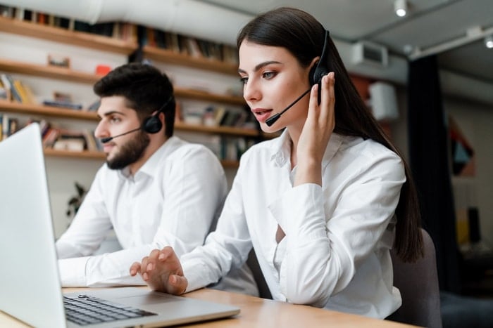 insurance agent on headset talking to client