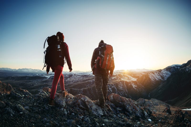 two hikers participating in an adventurous hike