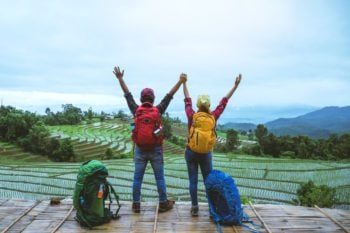 expat husband and wife hiking around thailand