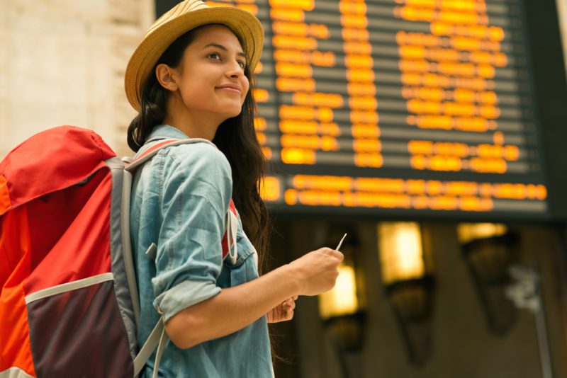 Girl at airport who has Patriot Travel Medical Insurance
