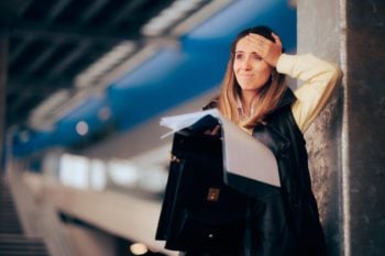 Stressed traveler trying to read the fine print on. travel insurance plan