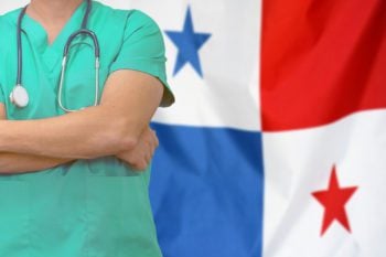 doctor standing in front of panama flag