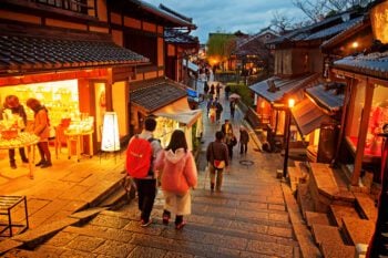 Tourists walking on a street leading to Kiyomizu Temple, Japan