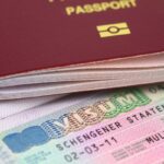 close-up of a Schengen Visa and passport
