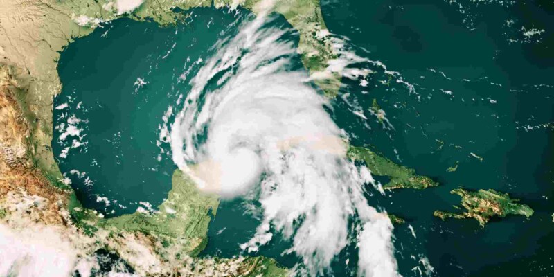 a typhoon cloud map, indicating the importance of securing hurricane travel insurance when traveling to storm-prone regions.