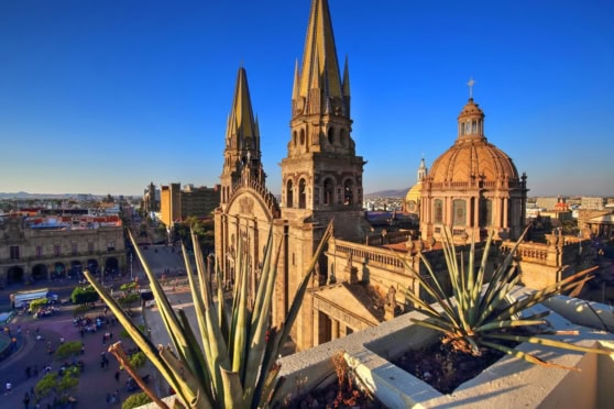 Beautiful view of Mexico City’s historic architecture featuring cathedral spires and a domed church, highlighting cultural heritage and stunning skyline.