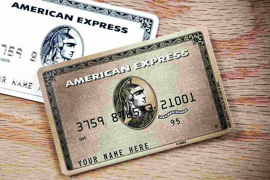 An image of two American Express cards on a wooden surface, emphasizing international insurance solutions for global travelers.