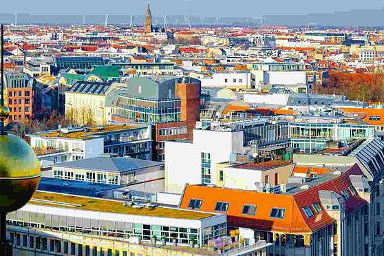 Sunny cityscape with modern buildings and colorful rooftops, representing global travel and living abroad, illustrating the need for reliable international health insurance coverage.