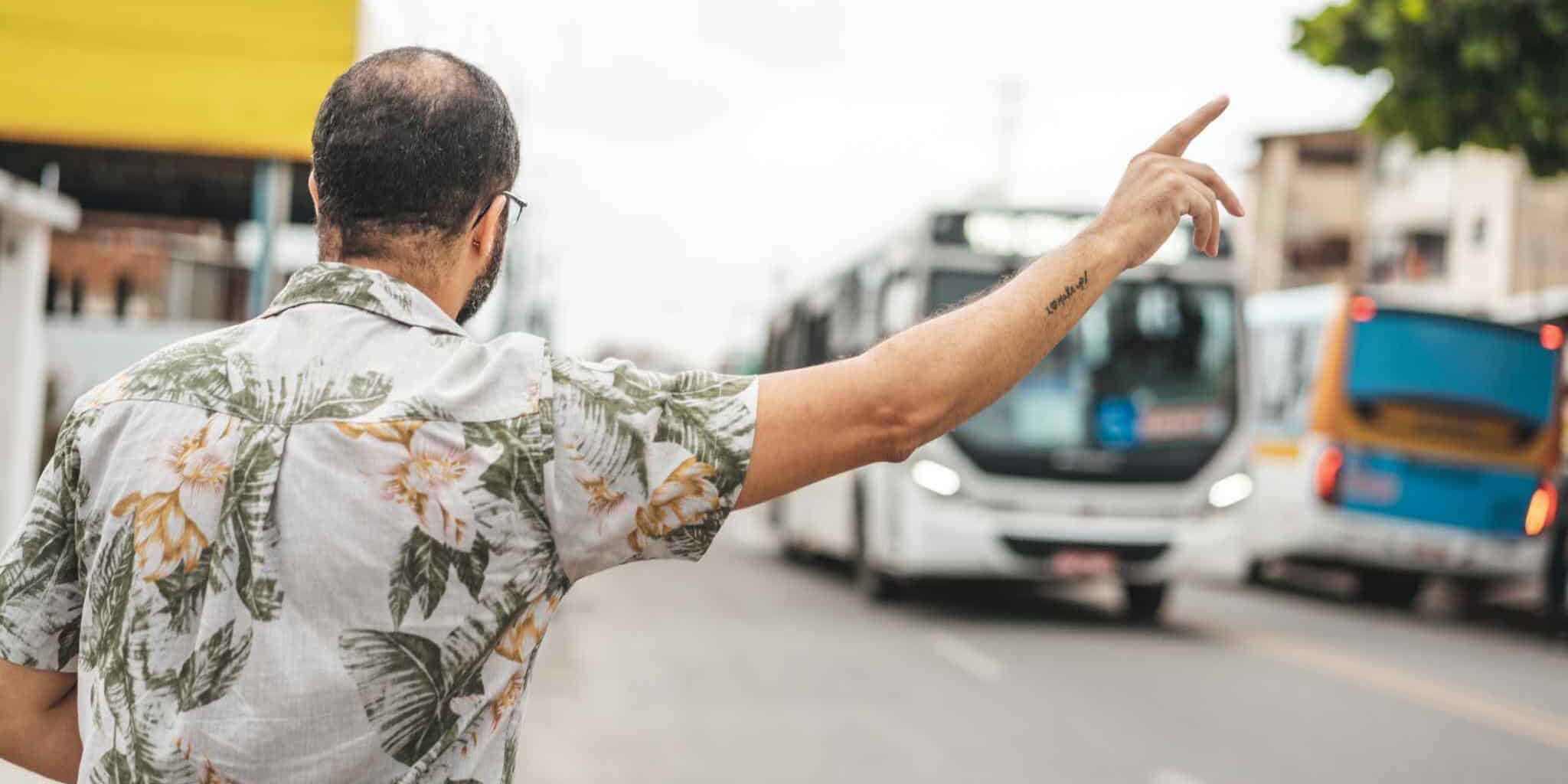 a man waiting at a bus stop in Brazil