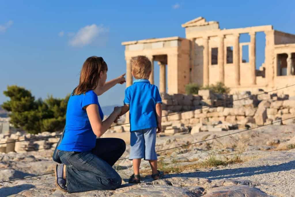 a mother and son looking at the Acropolis in Athens, Greece, one of the best family vacation ideas for 2026