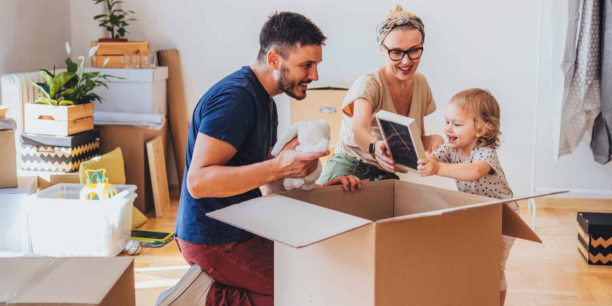 a young family packing up their belongings to move abroad