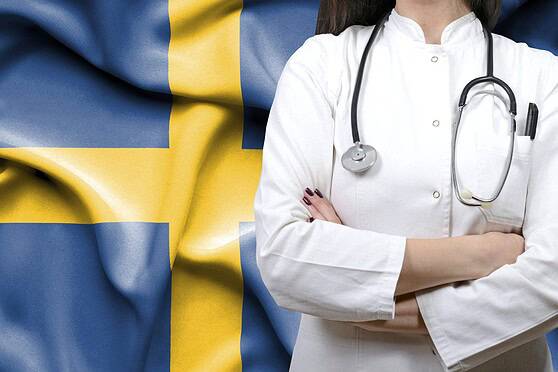 A healthcare professional with arms crossed against a Swedish flag background, emphasizing global health insurance options for international citizens.