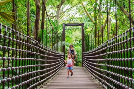 Bright, vibrant image of a mother and children exploring nature, representing travel, adventure, and family fun.