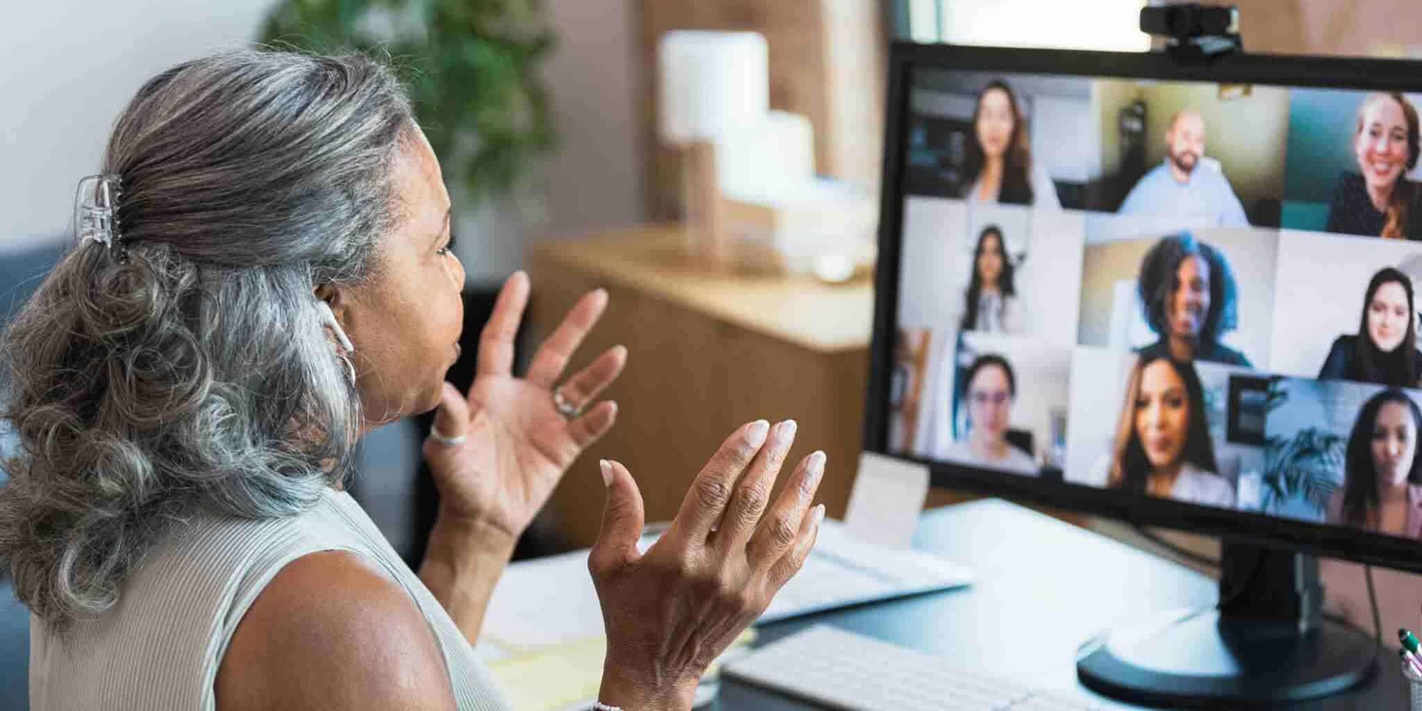 a team leader having an online meeting with collegues, having researched how to manage a remote team successfully across borders 