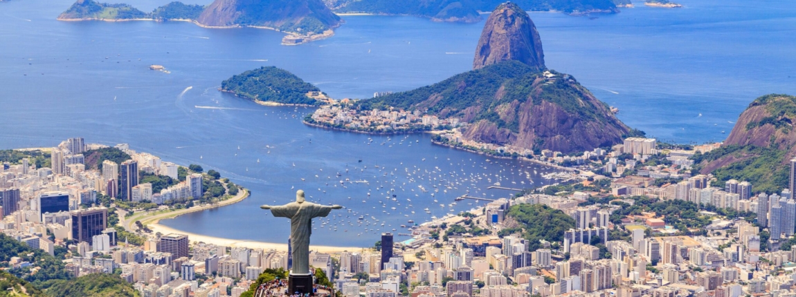 Breathtaking aerial view of Rio de Janeiro featuring Christ the Redeemer statue overlooking the city, Sugarloaf Mountain, and scenic Guanabara Bay, promoting the 2025 International Conference on Innovation.