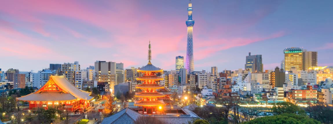 A vibrant view of Tokyo cityscape featuring a historic pagoda and the modern Tokyo Skytree tower during dusk with colorful sky.