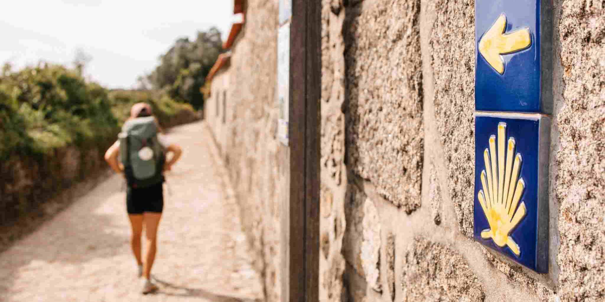 a female backpacker hiking the 'Camino de Santiago' in Galicia, Spain