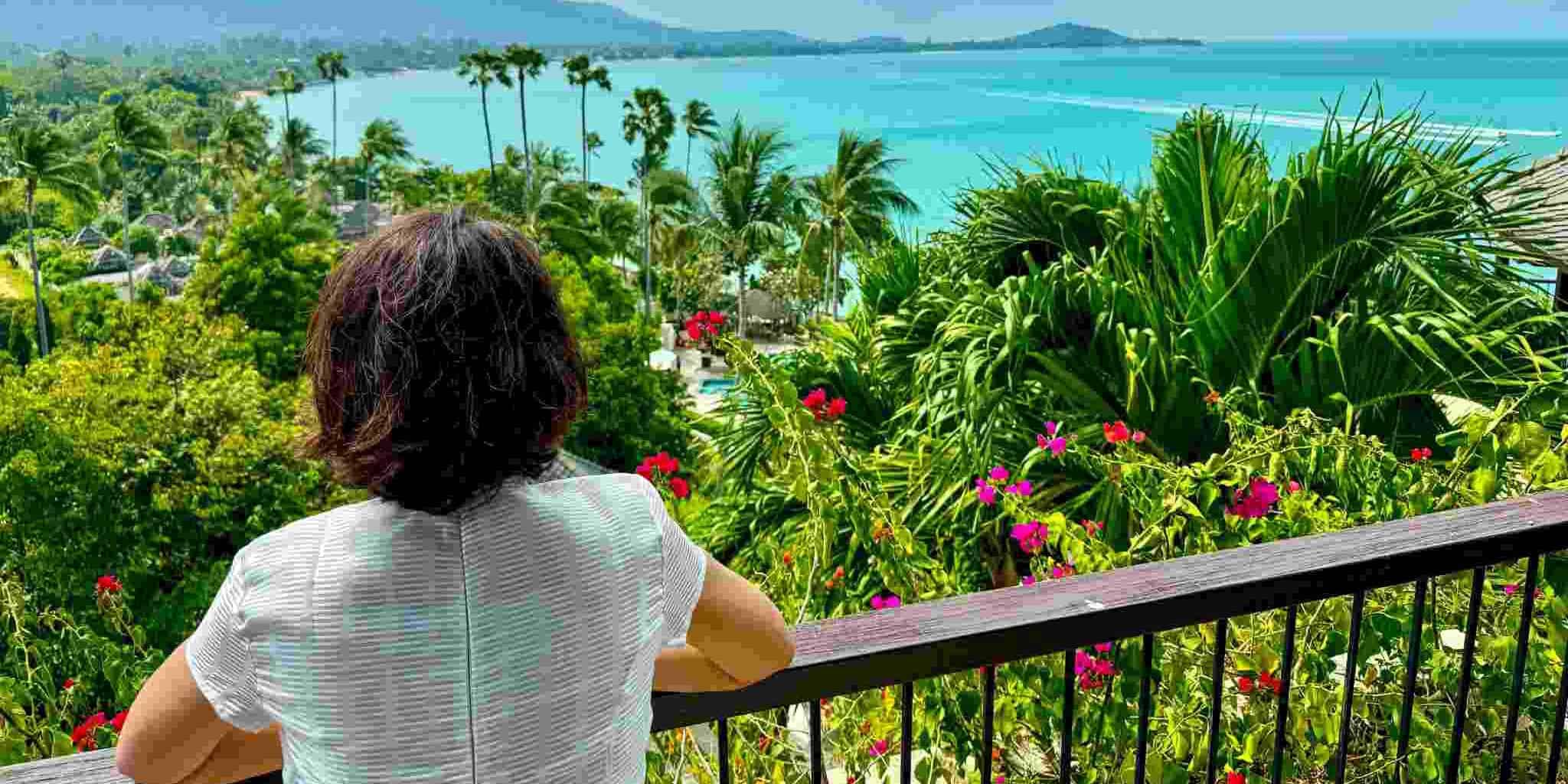 a female traveler enjoying an ocean view of Ko Samui in Thailand
