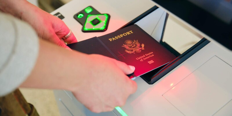 a traveler checking in at the airport with their US passport