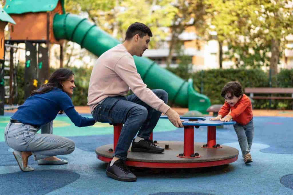 family playing in a park