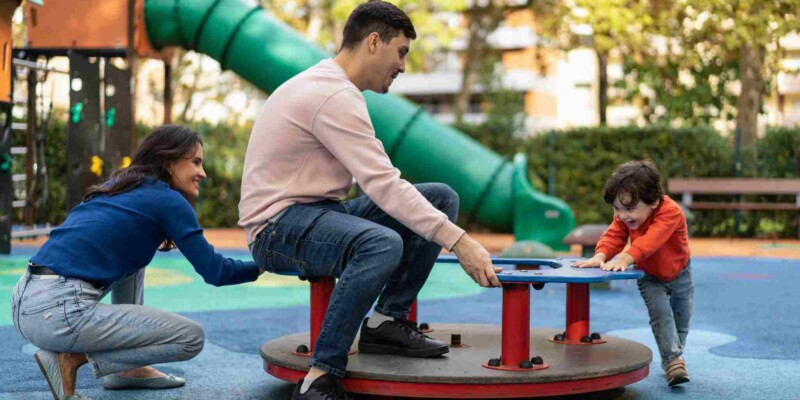 family playing in a park