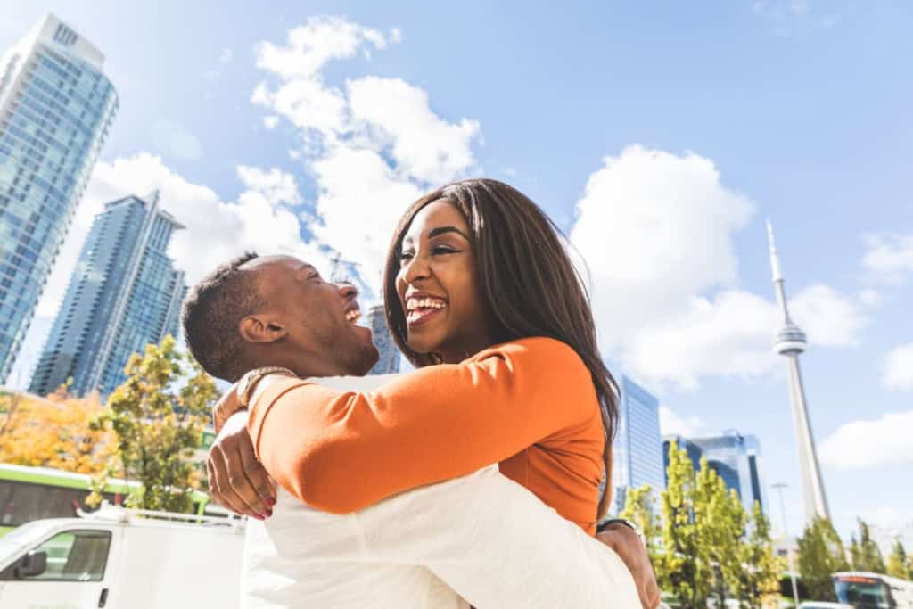 Happy black couple having fun in Toronto city