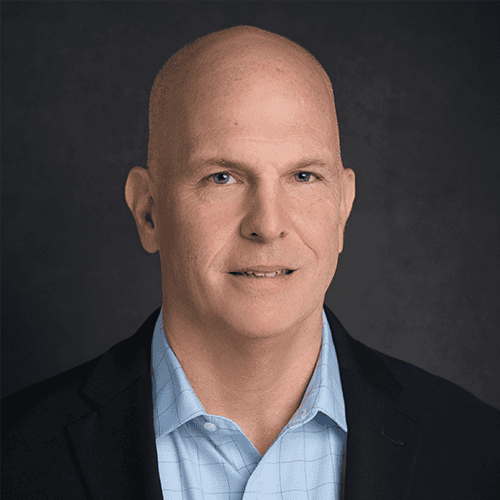 A professional headshot of Joe Cronin, CEO of International Citizens Insurance.