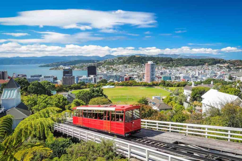 A cable car traveling towards the city of Wellington, New Zealand, one of the best cities to live in as an expat