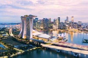 Singapore skyline at dusk with Marina Bay Sands and ArtScience Museum.