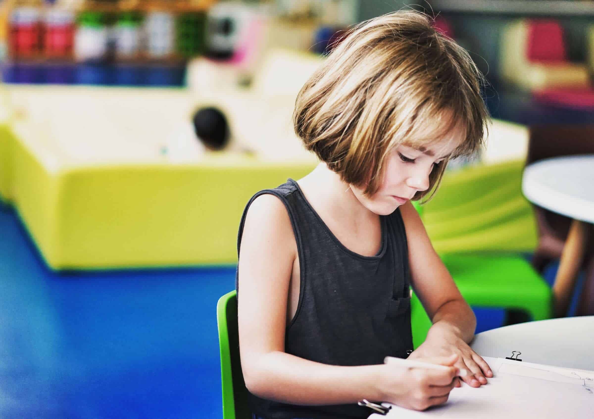 a young girl studying at an international school