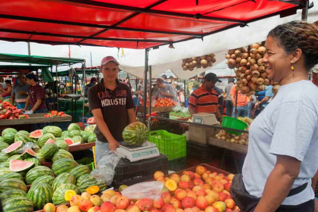 a woman shopping at a local market after retiring in Costa Rica