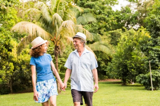a happy couple walking hand in hand after retiring in Costa Rica
