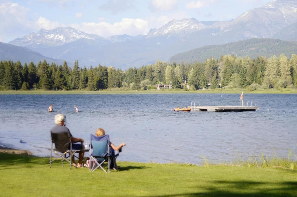 A retired couple watching Alta Lake in Whistler, Canada