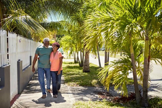 a retired couple walking along a street in Florida, one of the best places to retire in the US