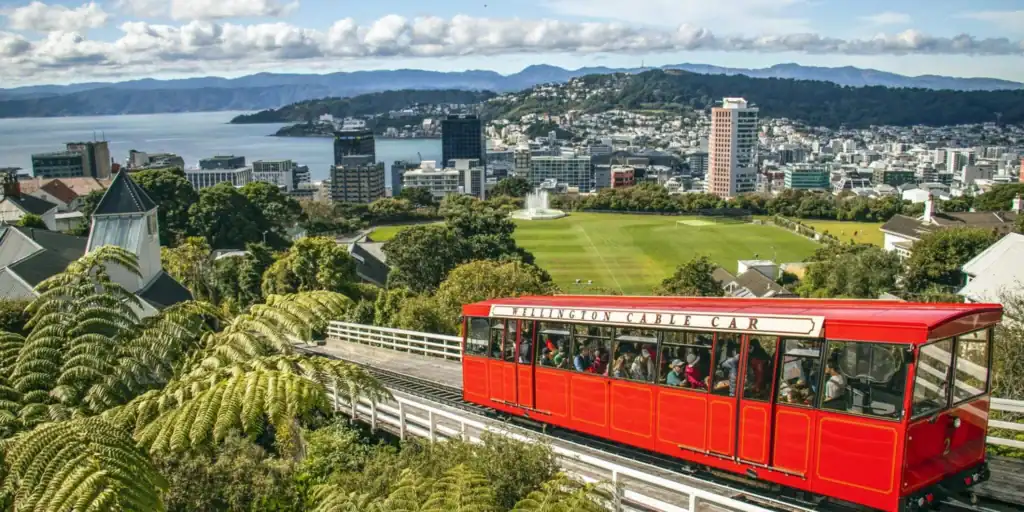 Scenic view of Wellington with a red cable car, showcasing the city's landscape and urban environment in New Zealand.
