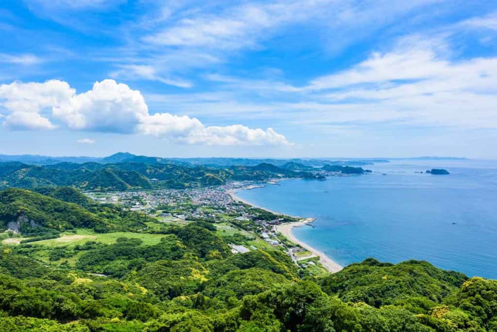 Beautiful coastal landscape of Japan with lush greenery and ocean views.