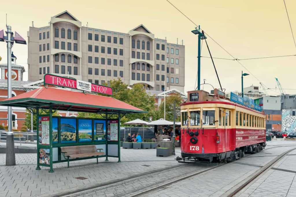 Vintage red tram in Wellington, New Zealand, serving as a popular tourist attraction and transportation option in the city.