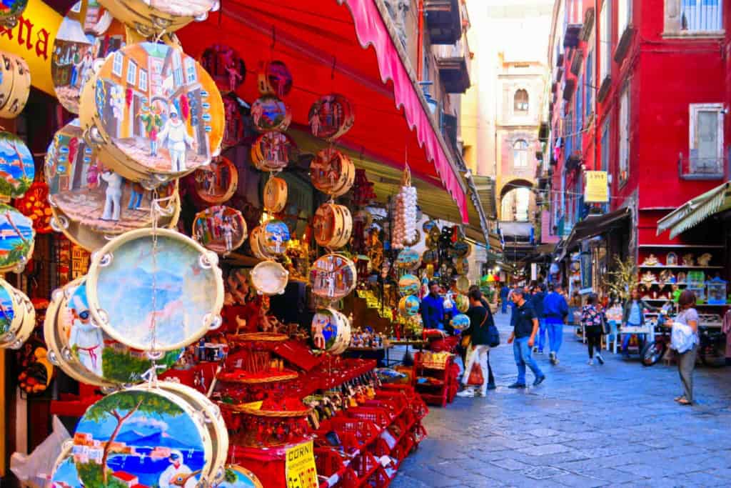 Colorful street market with souvenirs in Naples, which has one of the most affordable cost of living in Italy