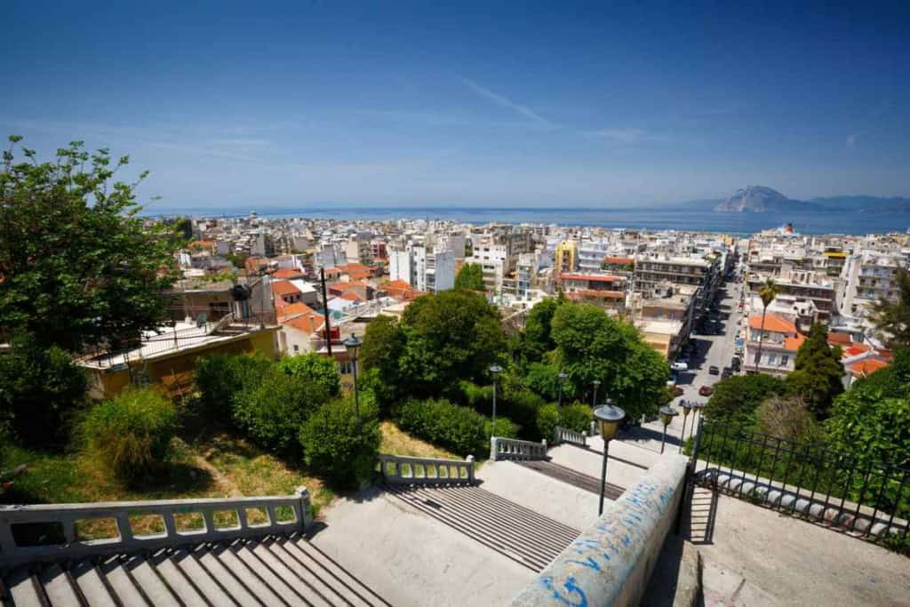 Greece cityscape with ocean view and vibrant neighborhood.