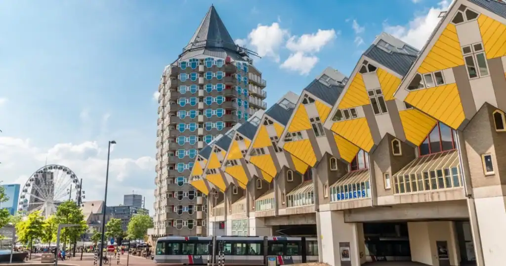 Modern and colorful Dutch houses with distinctive yellow facades and unique design elements in the Netherlands.