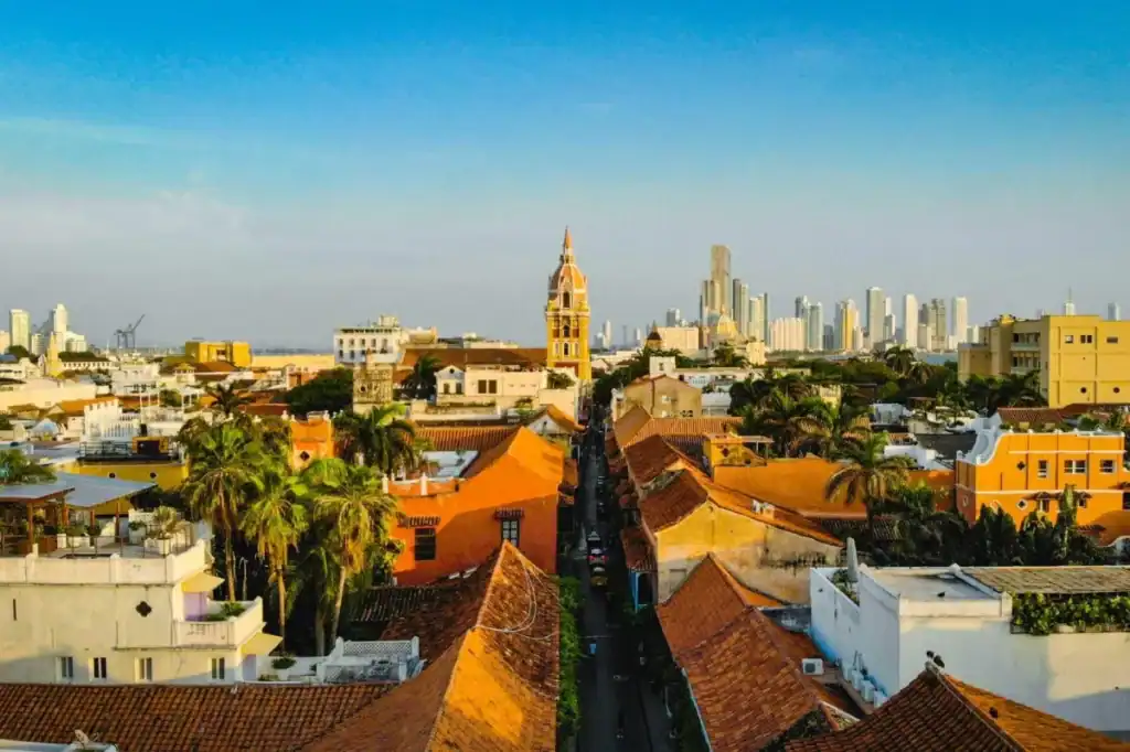 Colombia cityscape with historic and modern buildings under a clear blue sky.