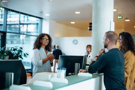 International citizens consulting with a representative at an embassy or consulate about applying for citizenship abroad.